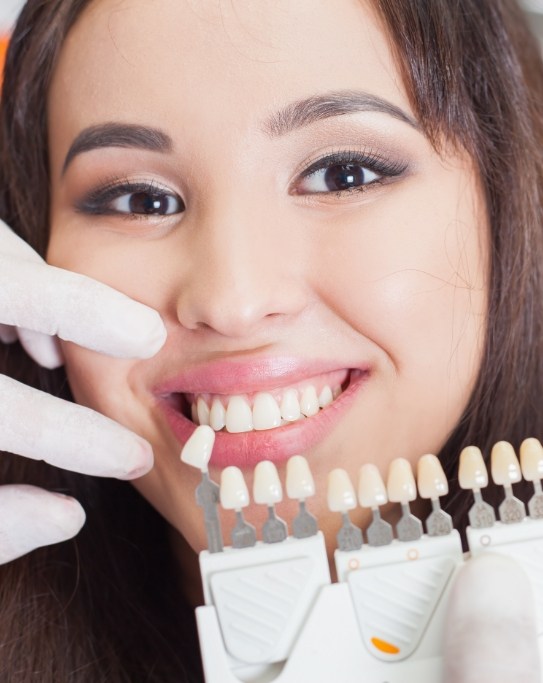 Young woman getting fitted for veneers by cosmetic dentist
