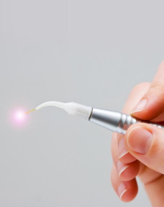 Hand holding a dental laser pen