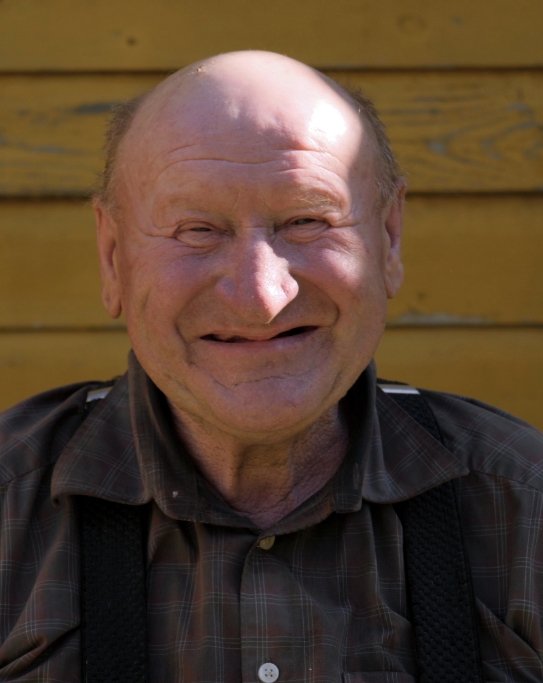 Senior man smiling with multiple missing teeth