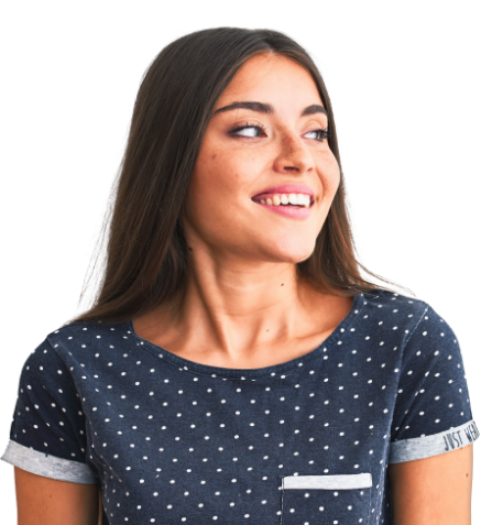 Smiling woman in blue and white polka dot blouse