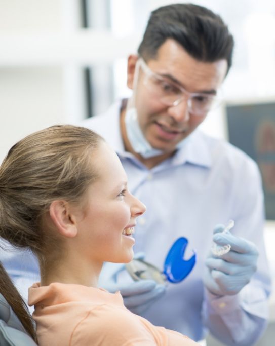 Dentist showing Invisalign to a patient