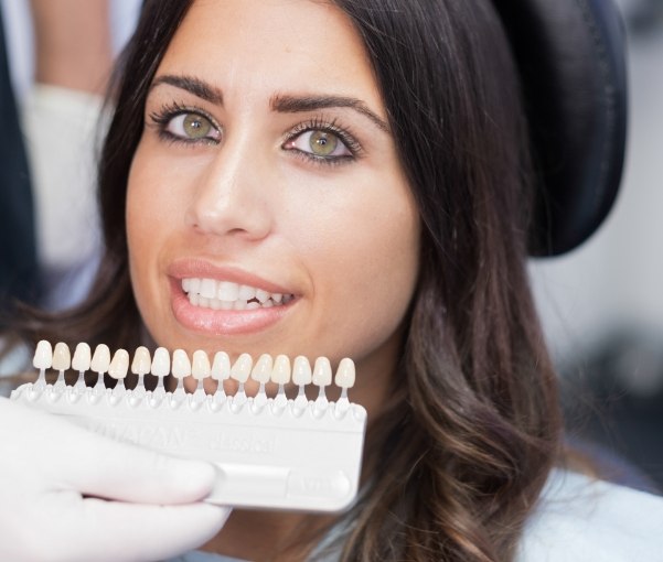 Woman being fitted for veneers by her New York cosmetic dentist