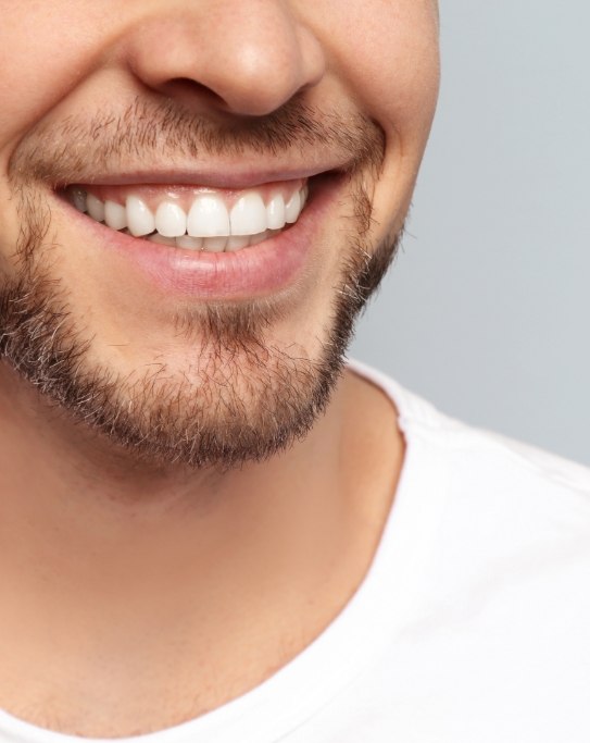 Close up of smiling man with short beard