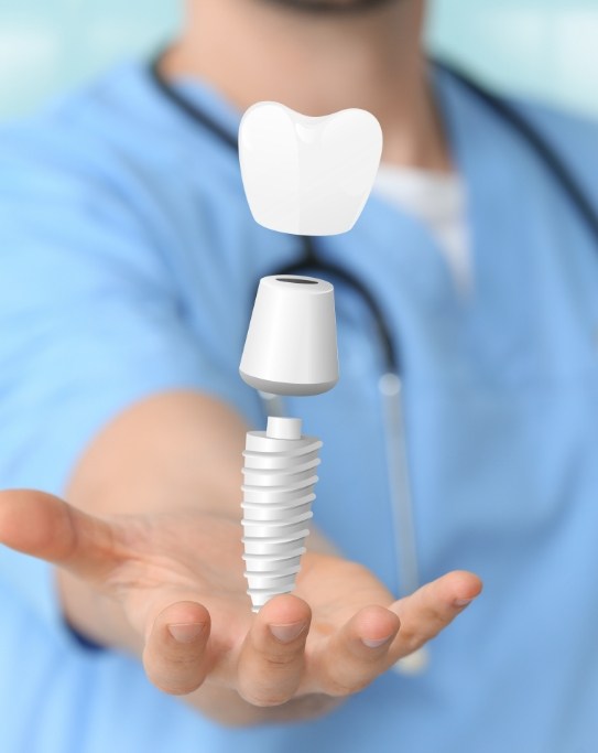 Person with hologram of a dental implant in their hand