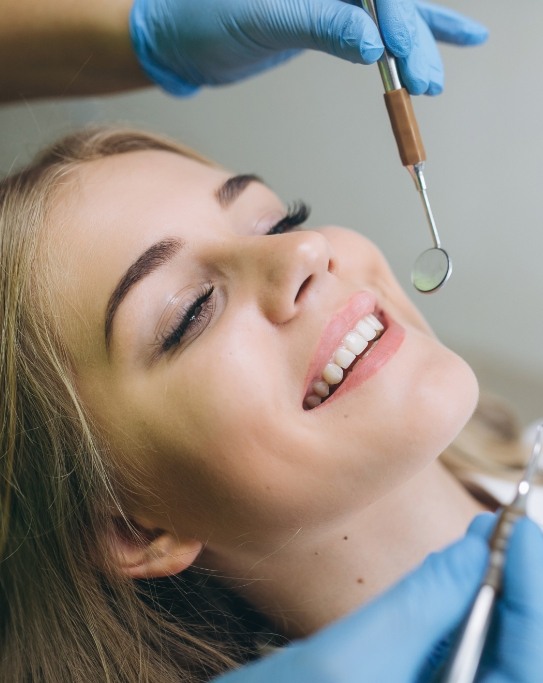 Woman receiving dental treatment