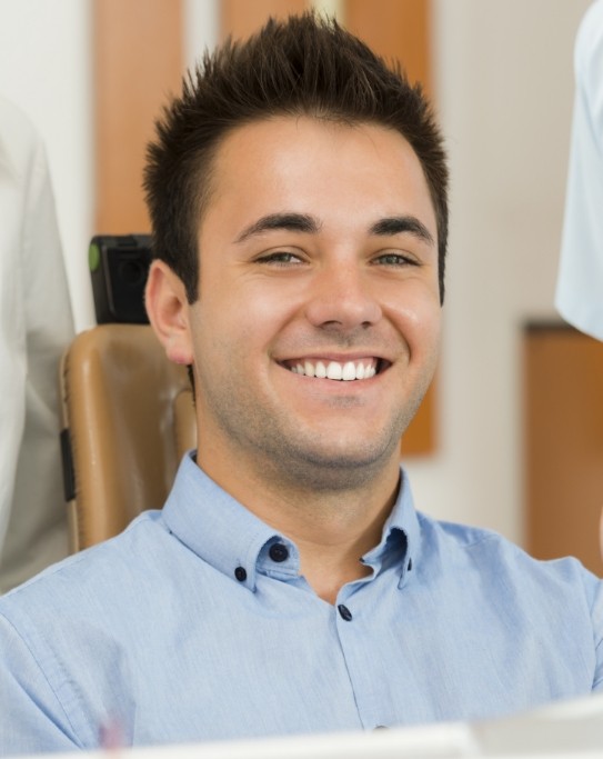 Man smiling in dental chair