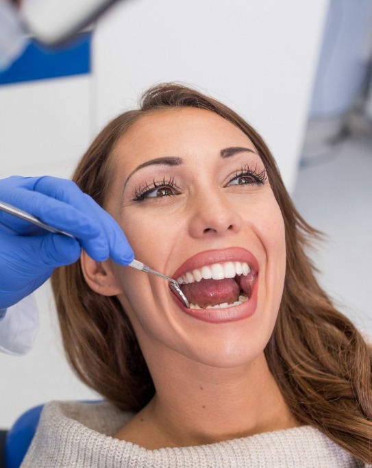 Woman receiving a dental checkup