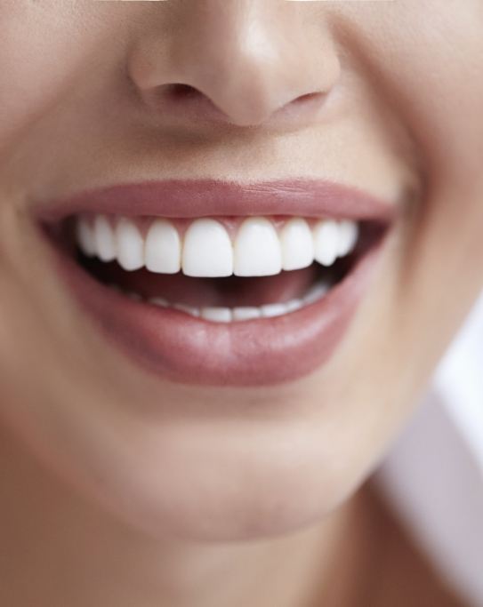 Close up of mouth with flawless straight white teeth