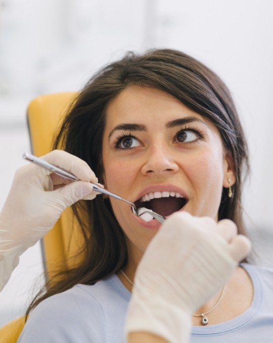 Woman receiving a dental exam