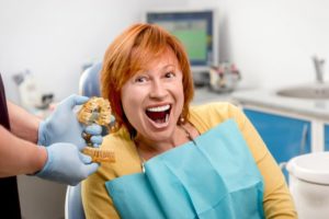 woman smiling sitting in dentist chair