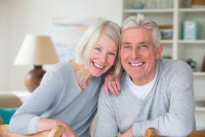 Older couple with dental implants.