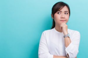 a woman wondering where her aligners are